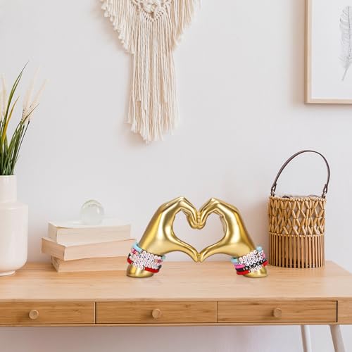 Goldene Herzhände Skulptur